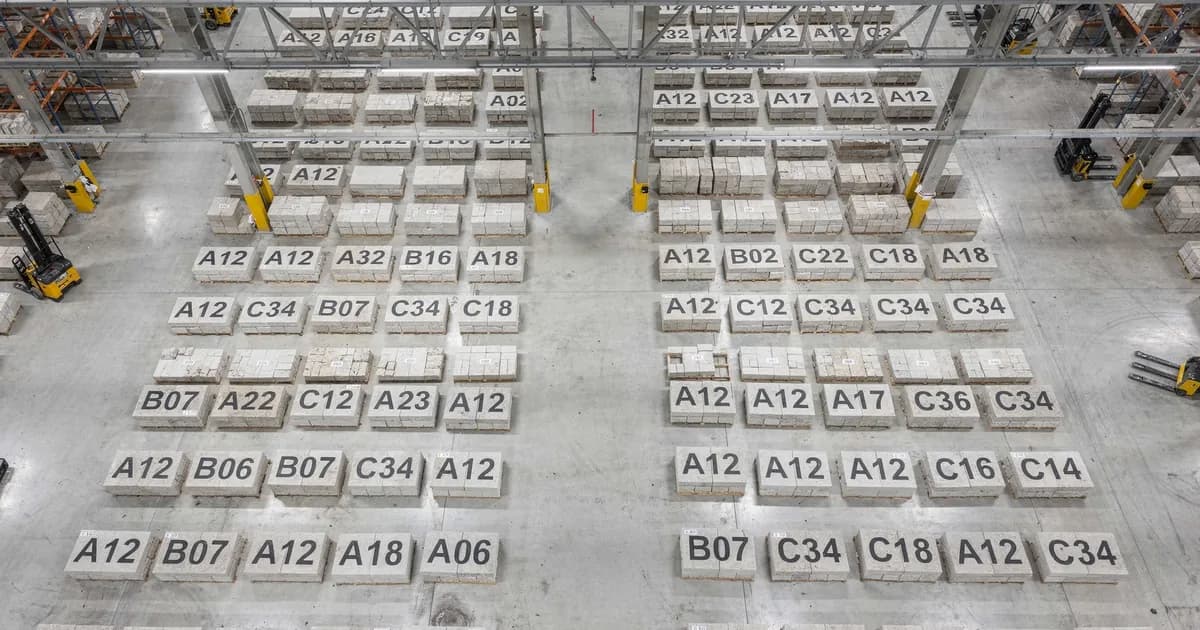 Aerial view of organized quarry warehouse with labeled stone blocks